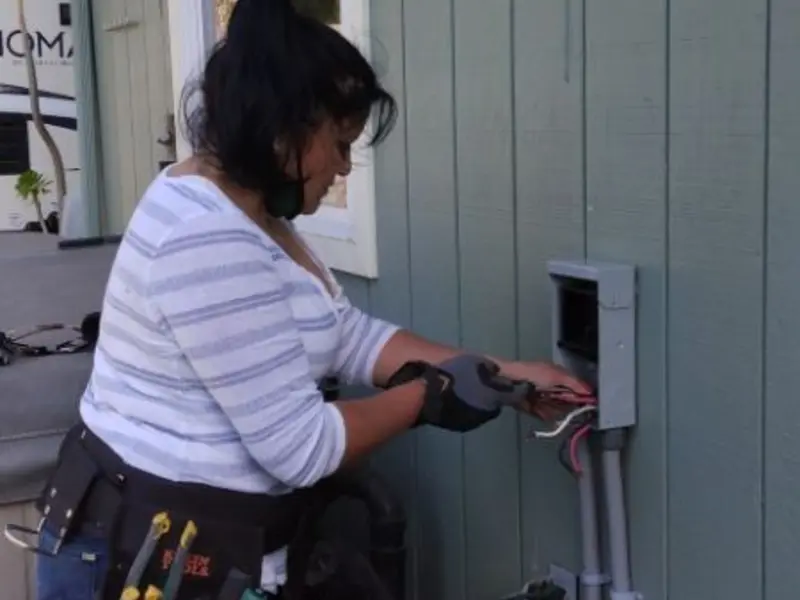 Licensed electrician wiring an exterior subpanel in Bangor